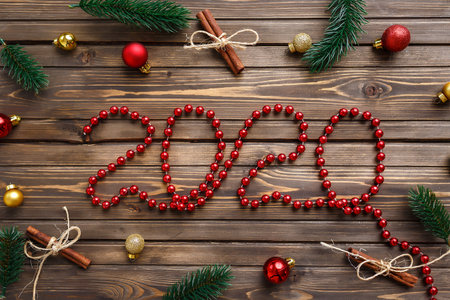 Happy New Year 2020. Symbol from number 2020 on wooden background with christmas decorationの写真素材