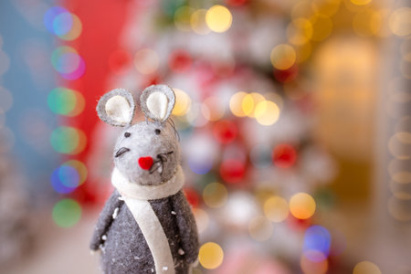 Little mouse toy, symbol of Chinese happy new 2020 in grey dress and new year decoration blur background. Horoscope sign 2020. New Year 's 2020 Symbol. Greeting Christmas card.の写真素材