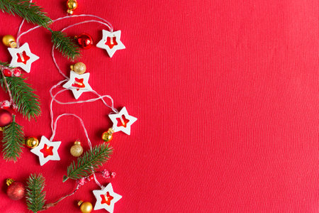 Christmas decorations on red background with copy space for text. Christmas or New Year red background.の写真素材