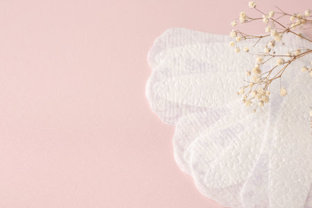 White sanitary pads, hygiene protection on a pink background. Gynecological menstrual cycle.の写真素材