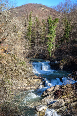 Waterfall on Zhane river on sunny winter day. Krasnodar Krai, Gelendzhik, Russia.