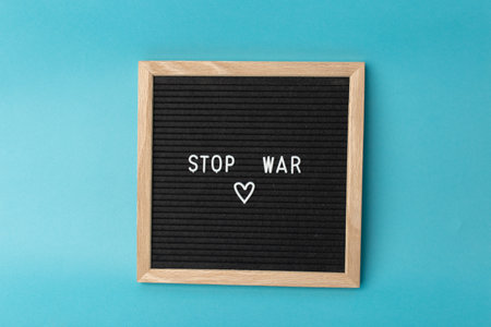 A sign with the inscription Stop the war on a blue background. There is no war. stop the war.の写真素材