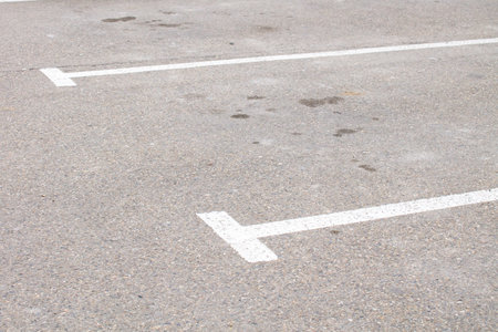 Parking spaces on gray asphalt, marking with white paint.の写真素材