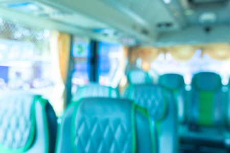 Blur background in empty public bus, abstract transportation background.の写真素材