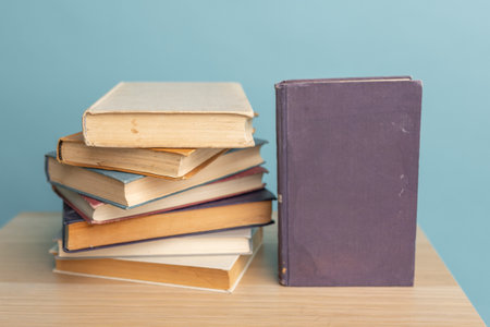 Many Books Piles. Hardback books on wooden table. back to school.の写真素材
