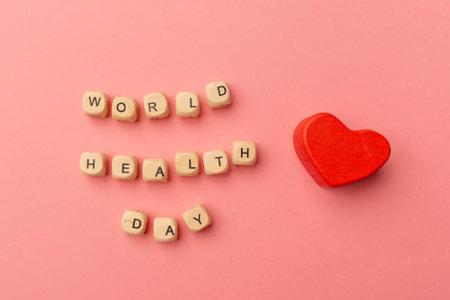 World Health Day, medical and healthcare. Red heart and text World Health Day on pink background.の写真素材