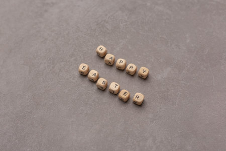 Minimal Easter concept. Text Happy Easter on gray background.の写真素材