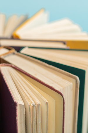 Old vintage books on blue background. World Book Day poster. education concept.の写真素材