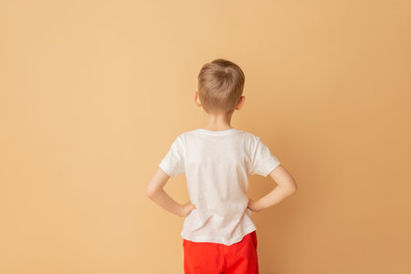 White t-shirt on a young man, view from the back.の写真素材