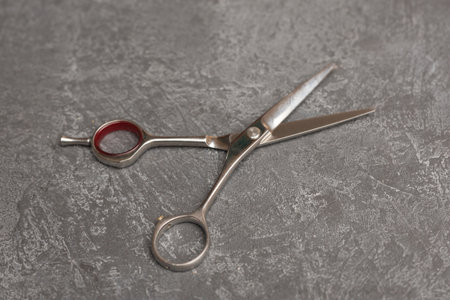 Stylish Professional Barber Scissors, Hair Cutting on black background. Hairdresser salon conceptの写真素材