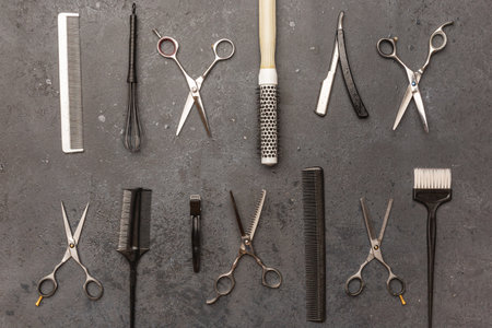Stylish professional barber scissors, hair cutting shears on black background. Hairdresser salon equipment concept, hairdressing setの写真素材