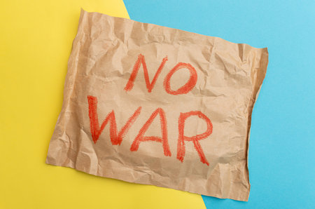 Sheet of craft paper with red color inscription No war. Crisis, peace, stop aggressionの写真素材