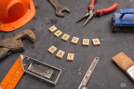 Happy Labor Day on blackboard with wrenchの写真素材