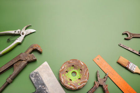 Happy Labor day concept. Different construction tools on green background, with copy space for textの写真素材