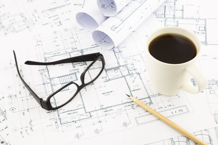 house blueprints and floor plan with glasses and coffee, architecture business concepts and ideasの写真素材