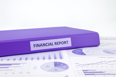 Purple binder of financial report place on graphs analysis of business annual reportsの写真素材