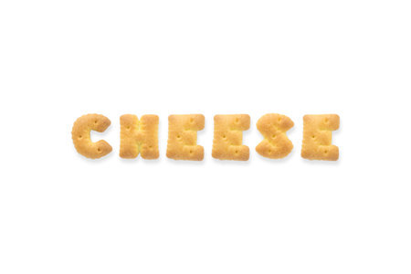 Collage of the capital letters word CHEESE. Alphabet cookie biscuits isolated on white backgroundの写真素材