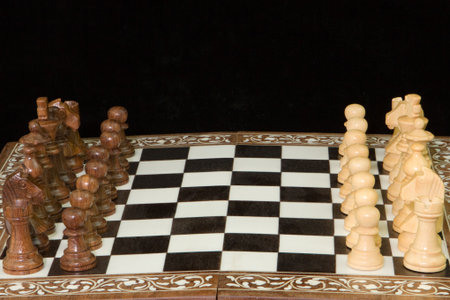 Chess pieces face-off on a chess board
