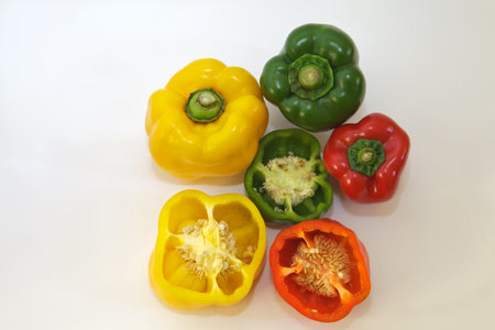red yellow and green pepper whole and cutの写真素材