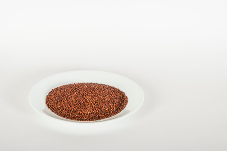 Ragi (Finger Millet) in a white plate on a white backgroundの写真素材