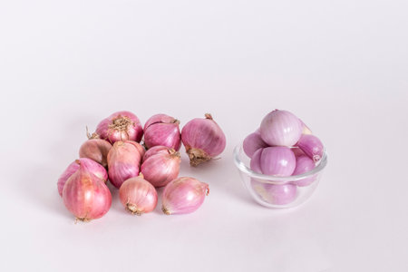 Peeled Shallots Allium ascalonicum on a white backgroundの写真素材