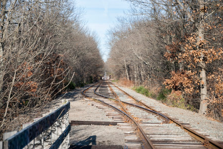 Single railroad track splits into two parallel tracksの写真素材
