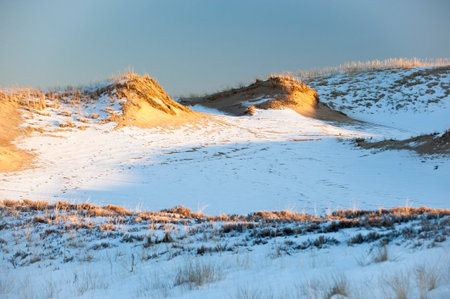 Sand dunes in winter with a thin coating of snowの写真素材