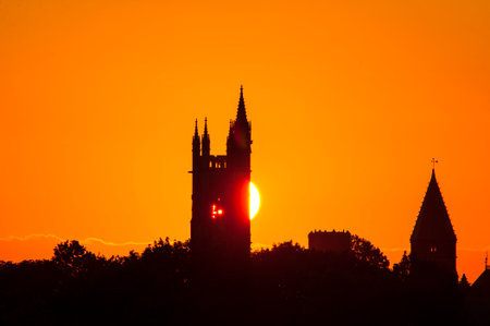 Sun drops behind buildings in Fairhaven's town centerの写真素材