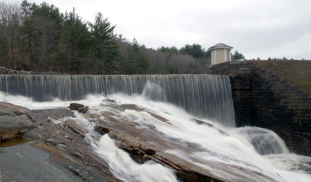 Water pours over spillway at Barden Reservoirの写真素材
