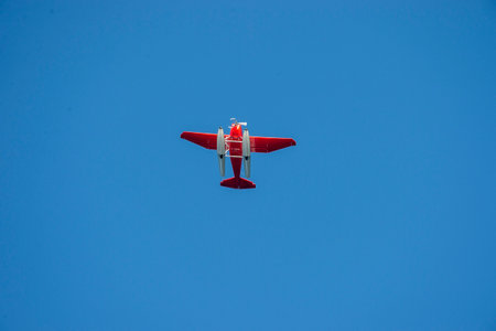 Floatplane fights the wind under a blue sky