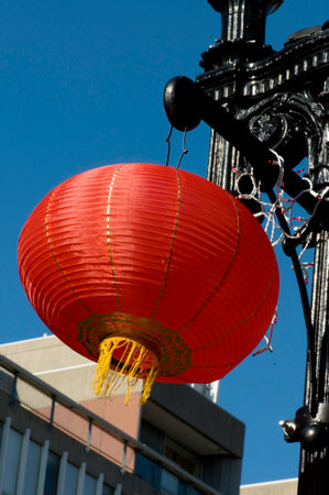 Chinese red lantern swings in stiff breezeの写真素材