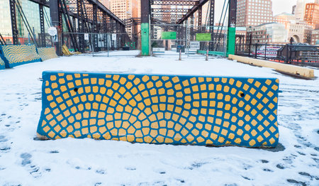 BOSTON, MASSACHUSETTS - JANUARY 21, 2016: Concrete traffic barrier stands out against the snowのeditorial素材