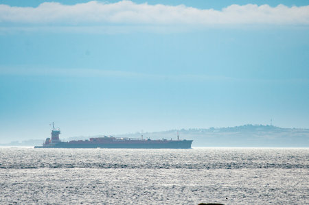 Workboat in Buzzards Bay framed against Cuttyhunk Island on hazy morning