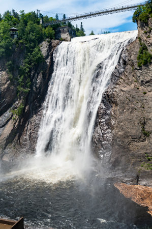 Suspension bridge offers dramatic view above 275-foot Montmorency Fallsの写真素材