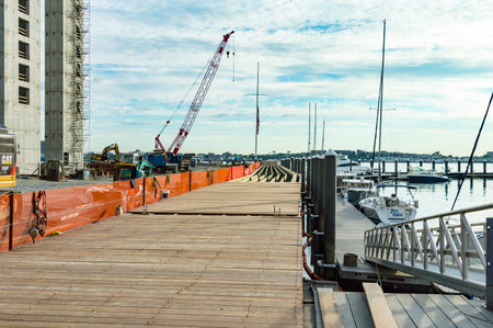 South Boston, Massachusetts, USA - June 16, 2016: Boston's Harborwalk being extended along side 50 Liberty condominium project constructionのeditorial素材