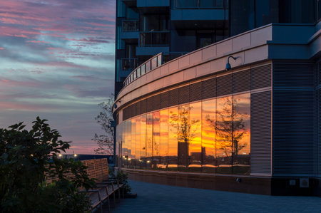 Disjointed reflections cloudy sunrise South Boston waterfront