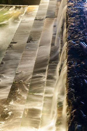 Long exposure of cascading fountain in tidal well along Harborwalk in South Bostonの写真素材