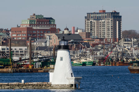 New Bedford, Massachusetts, USA - November 29, 2014: Palmer's Island lighthouse in New Bedford's inner harbor set against docks and downtownのeditorial素材
