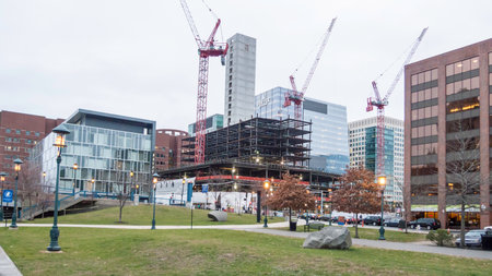 South Boston, Massachusetts, USA - December 17, 2015: Construction at One Seaport Square viewed from Children's Wharf along the Harborwalk on Fort Point Channel in South Bostonのeditorial素材