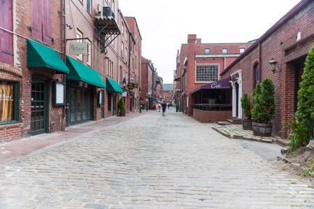 Portland, Maine, USA - August 10, 2009: Cobblestones and restaurants along Wharf St. in downtown Portland, Maineのeditorial素材