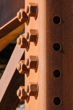Rusty steel girders and bolts under old overpassの写真素材