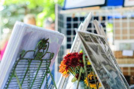 Flowers and photographs on display at arts and crafts showの写真素材