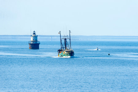 New Bedford, Massachusetts, USA - May 17, 2017: Fishing boat Sasha Lee passing Butler's Flat...