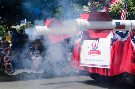BRISTOL, RHODE ISLAND - JULY 4, 2011: Smoke from rocket-powered float at Fourth of July parade in Bristol, Rhode Islandのeditorial素材