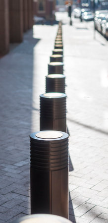 Line of protective bollards along New York streetの写真素材