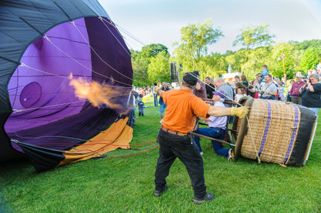 Quechee, Vermont, USA - June 19, 2009: Crew filling hot air balloon at the Quechee Hot Air Balloon Craft and Music Festivalのeditorial素材