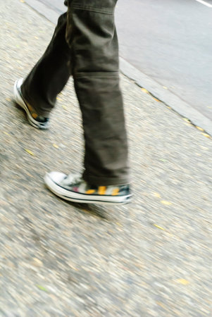 New York, New York, USA - October 25, 2008: Colorful sneakers  on wet New York City sidewalkのeditorial素材