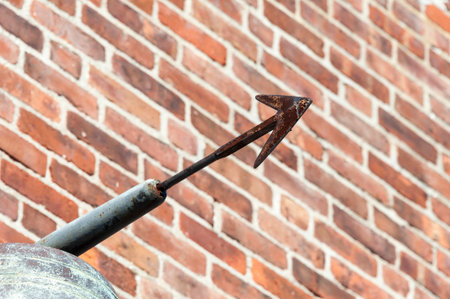 Rusty old harpoon used as building decorationの写真素材