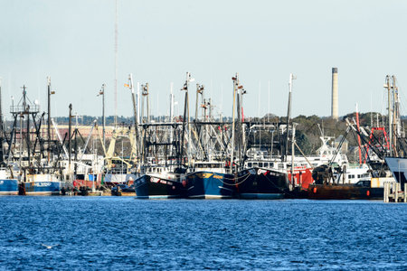Fairhaven, Massachusetts, USA - November 4, 2017: Thicket of commercial fishing vessels tied up alongside dock on Acushnet River in Fairhaven, Massachusettsのeditorial素材