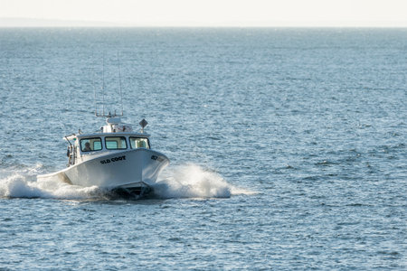 New Bedford, Massachusetts, USA - November 21, 2017: Fishing boat Old Coot heading toward New Bedford inner harbor from Buzzards Bayのeditorial素材